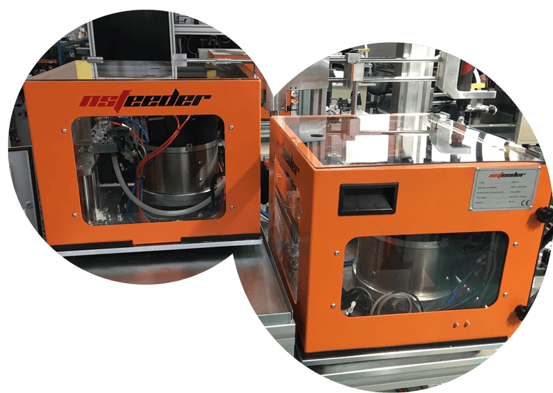 Two NSFeeder NSF-R screw feeder units with orange frames, transparent windows, and technical nameplate